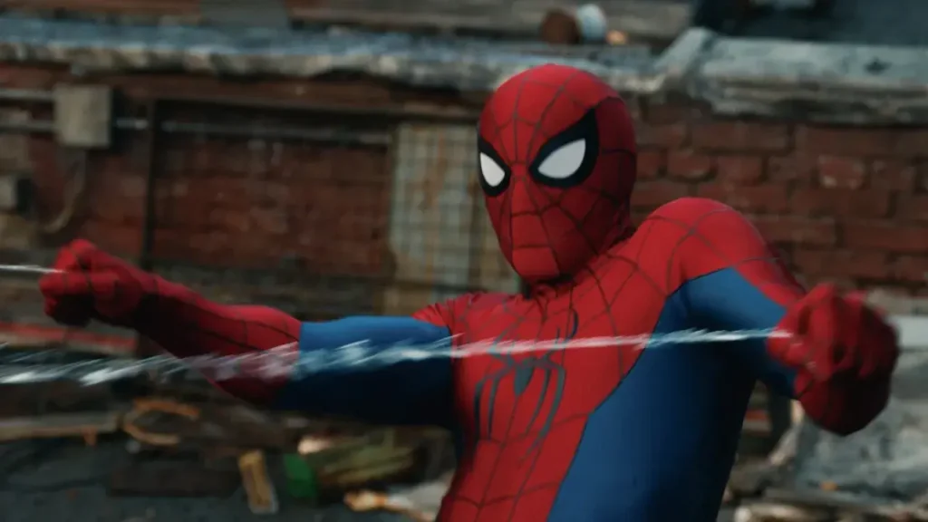 Spider-Man in a red and blue suit pulling on web lines against an urban brick background.